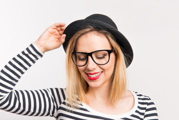 Portrait of a young beautiful woman in studio on a white background.