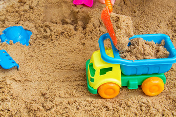 child playing in the sandbox