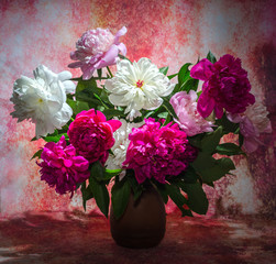 bouquet of ten bright burgundy, tender pink and white peonies in