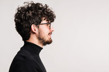 Portrait of a young man in a studio. Copy space.