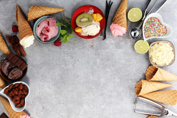 Fototapeta na wymiar Vanilla frozen yogurt or soft ice cream and waffle cone and fruits.