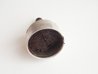 Used ground coffee on white background