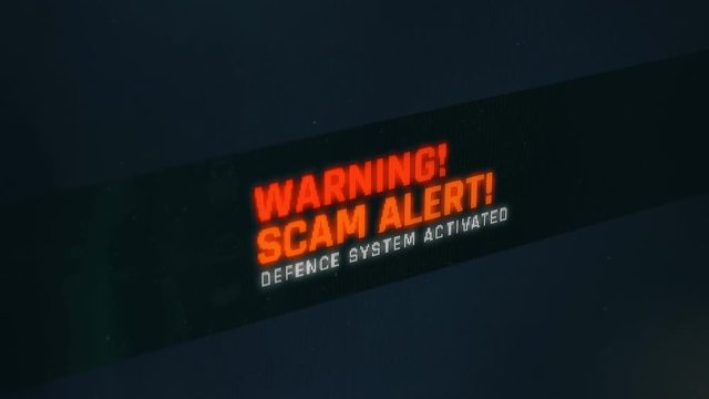 Warning, scam alert, defence system activated, notification on screen. Computer alert message