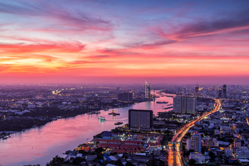 Naklejka na ściany i meble Beautiful sky while sunset over the Bangkok city,Thailand. 