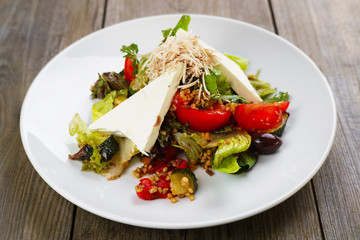 Vegetable salad with feta and cashew, restaurant serving. Mediterranean food, appetizer, banquet, restaurant menu, dining concept