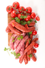 assorted raw sausage on white background