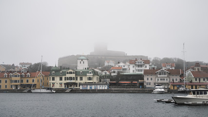 Fototapeta na wymiar Marstrand costal village in fog