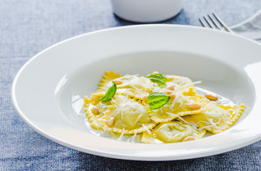Ravioli with ricotta and spinach and parmesan.Italian traditional pasta dish.