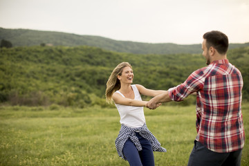 Fototapeta premium Loving coulpe having fun in the spring nature