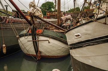 Close-up of prow and rusty anchor of boats moored in port at Amsterdam. Famous for its huge...