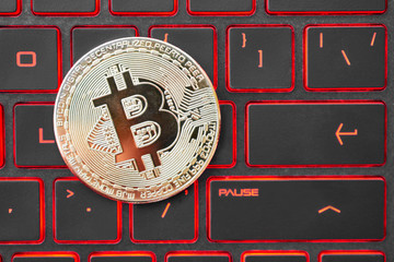 Golden bitcoin on the keyboard