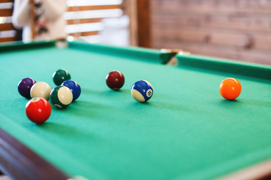 balls on a billiard table . game of American billiards