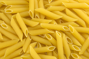 Fresh pasta penne texture background