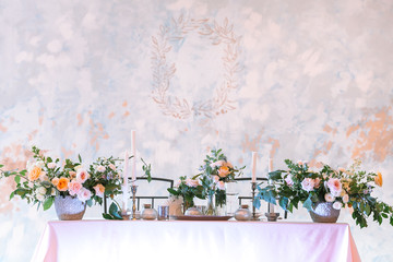 arrangement, wedding, design concept. gorgeous wedding table setting for two person decorated with great bouquets of flowers and candles in different holders. with empty space for text
