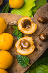 Fresh ripe mushmula or loquat fruit. Good for breakfast and desserts. Evergreen subtropical tree orange sweet and juicy fruit widely spread in Georgia, Japan, Korea, Spain and other asian countries.