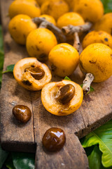 Fresh ripe mushmula or loquat fruit. Good for breakfast and desserts. Evergreen subtropical tree orange sweet and juicy fruit widely spread in Georgia, Japan, Korea, Spain and other asian countries.