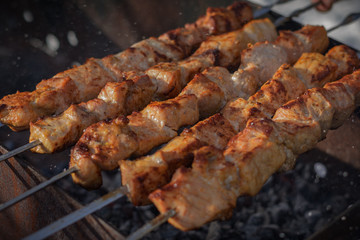 Grilling shashlik on barbecue grill