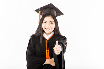 Beautiful Attractive Graduated Asian woman in cap and gown holding certificated and show thumbs up good hand sign feeling so proud and happiness,Isolate on white background,Education Success concept