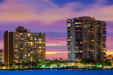 Fototapeta na wymiar Beautiful twilight condominiums on the water bay
