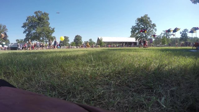 Time Lapse Of People Walking Across A Field At A Music Festival, Bonnaroo.