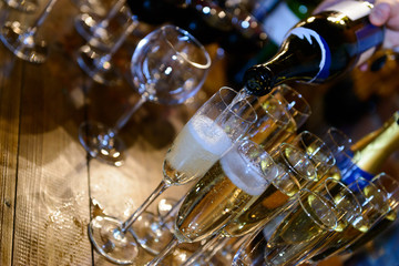 Champagne wine chrystal glasses set in night club bar at expensive luxury restaurant cocktail party wedding celebration