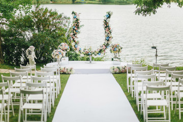 Fototapeta premium Wedding ceremony arch near the beautiful lake