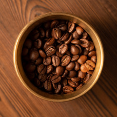 Roasted Coffee Beans (Arabica) In A Metal Cup. Top View. CloseUp. Macro.