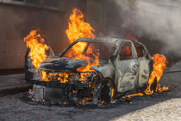 Fire engulfing a car 