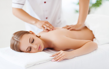 Fototapeta na wymiar beautiful girl enjoys massage and spa treatments
