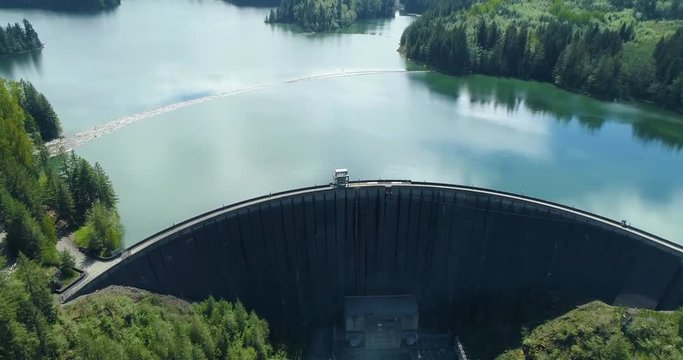 Aerial View Tilt Angle Up River to Man Made Lake Dam Water Reservoir