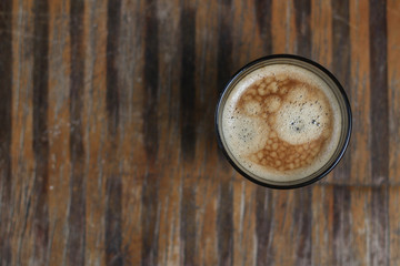 black coffee with foam, (a portion of fresh coffee)