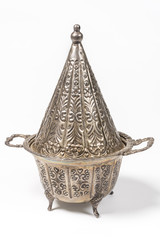Obraz premium Elegant metal Tajine pot used in Couscous based recipes in Northern Africa
