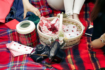 picnic basket with cherries and analog photo camera and jar on r