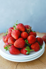 Strawberry Jam and Fresh Strawberries Textured Cement Gray Background and Jam Jar