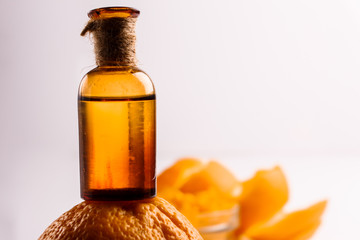 orange essential oil on a white background