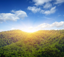 Naklejka premium Mountain with the sun