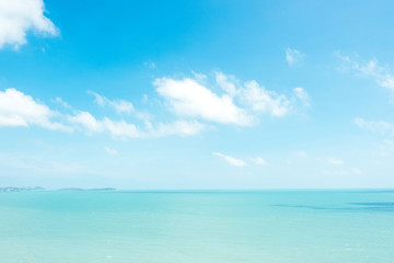 Beautiful white clouds on blue sky over calm sea background.