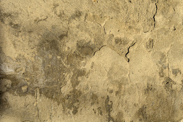 background, texture - old weathered cracked cement plaster on the wall