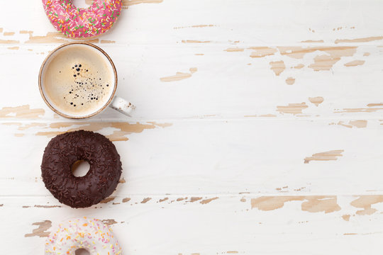 Coffee cup and donuts