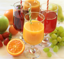 Variety of fruit juices and fruits, juice vitamin bar concept.