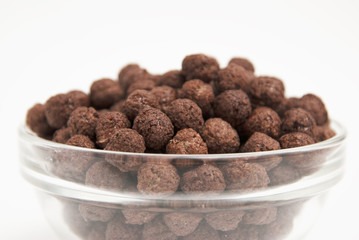 Chocolate Balls. Healthy Breakfast for the Child Chocolate Balls milk. Background of a dry breakfast - chocolate balls.