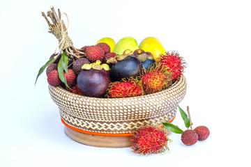 Rambutan, mango, mangosteen, lychee in bamboo basket   isolated on white background.