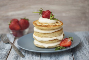 Sweet Pancakes with Cream and Strawbery. Health Breakfast Fruit Berry Vitamine Gray Rustic Wooden Background