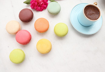 colorful macarons with coffee