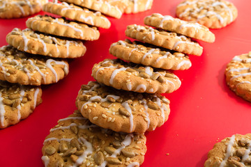 set of cookies with seeds on a red background
