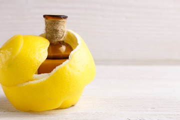 Lemon essential oil on a white background