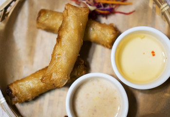 Spring rolls with sauce in Asian restaurant.