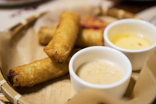 Spring rolls with sauce in Asian restaurant.