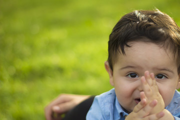 The baby takes it in her mouth