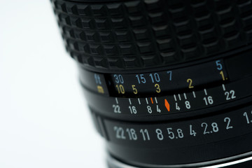 Lens Camera Photography Gear dslr mirrorless in a white background number aperture speed digital film art closeup macro detail button 